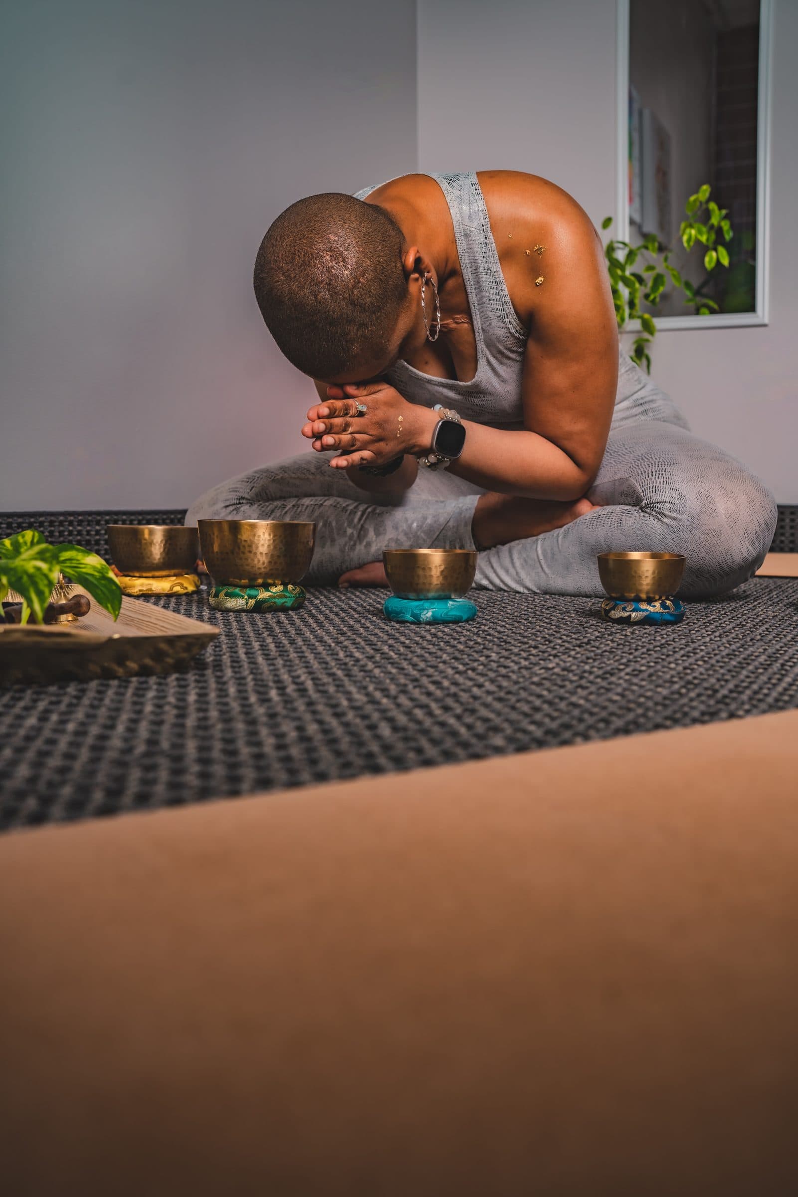 Dr. Crystal in deep meditation with singing bowls