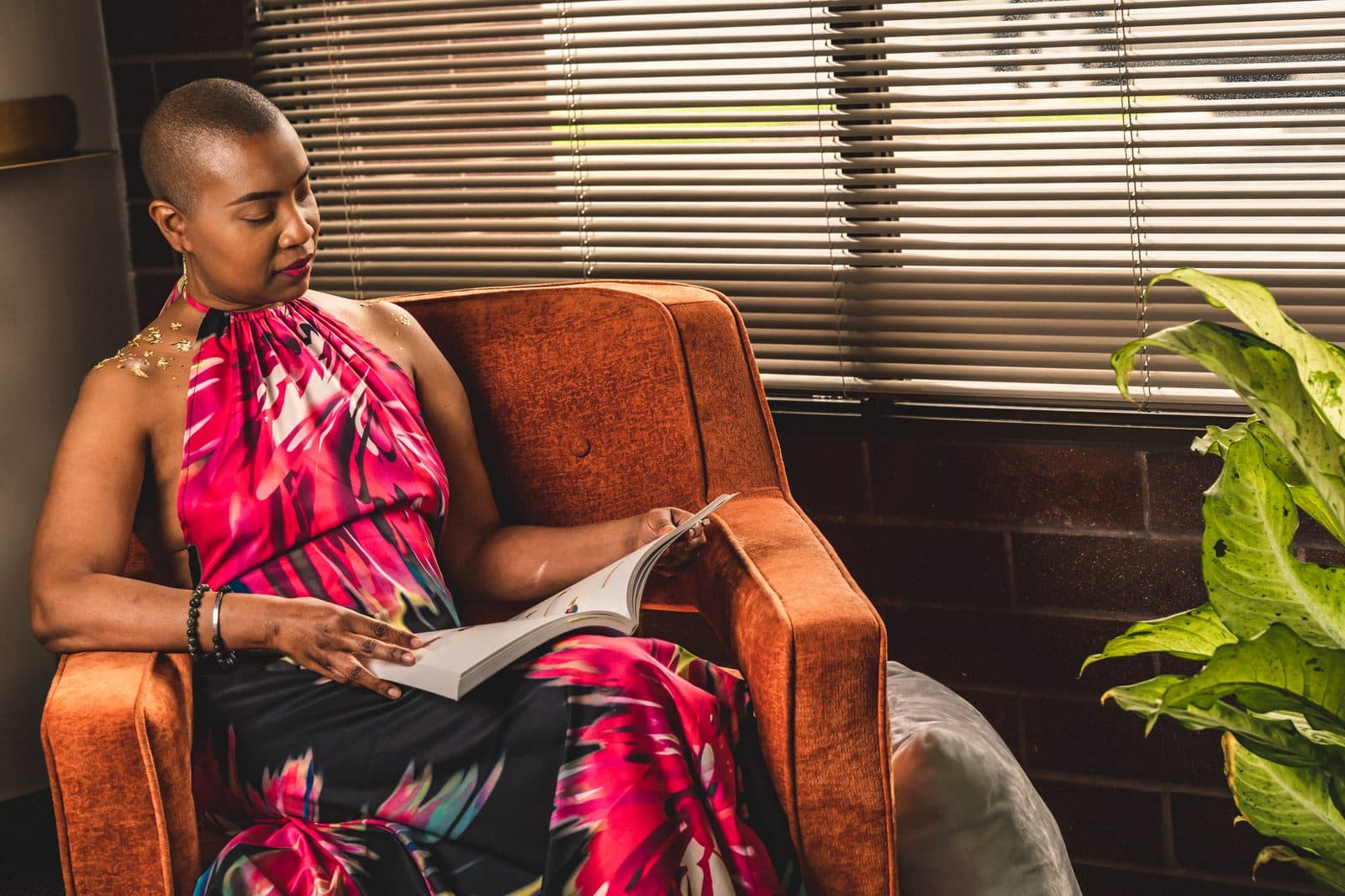 Dr. Crystal reading in a warm, reflective moment